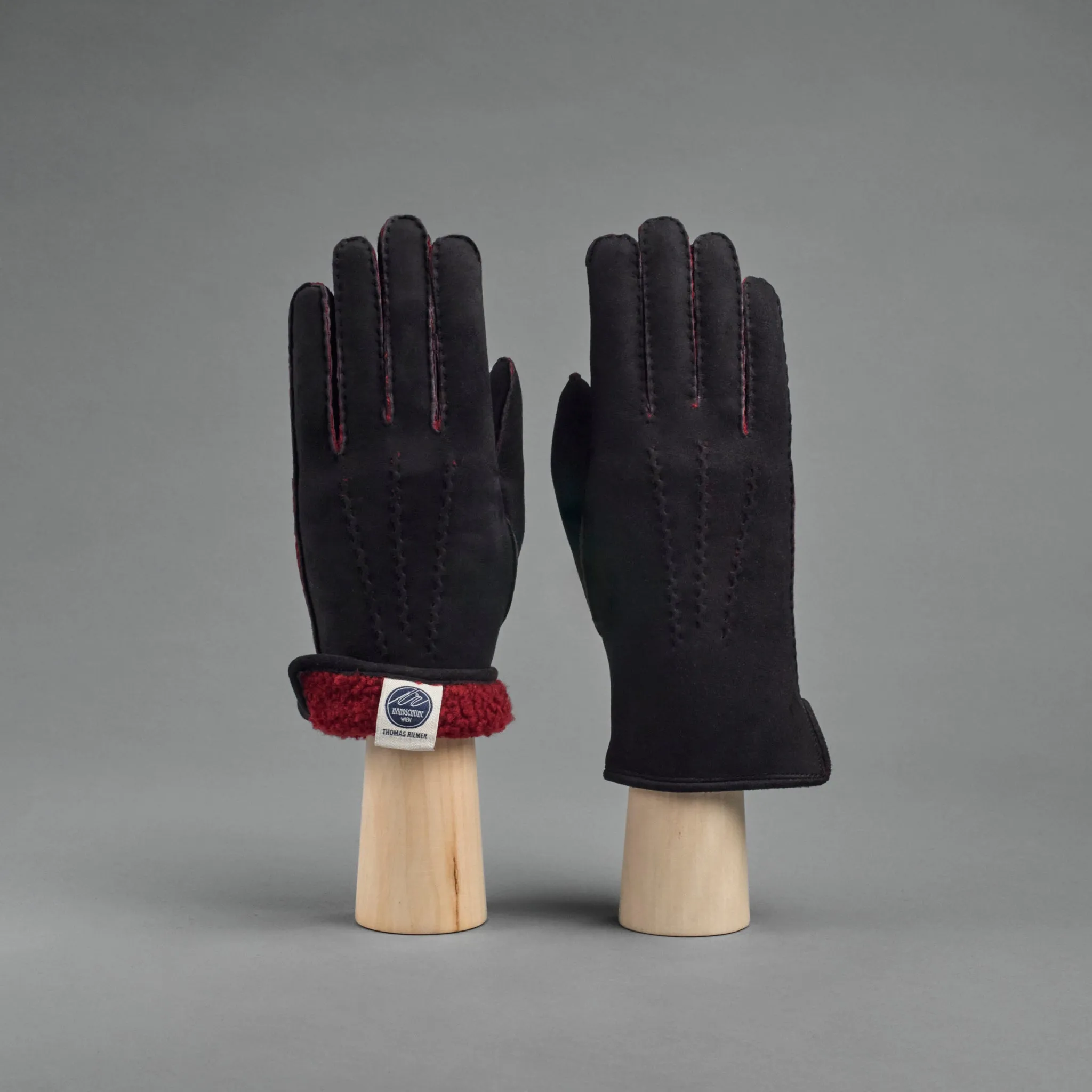 Ladies Gloves from Black Curly Lambskin lined with red Shearling